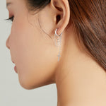 Orecchini donna croce lunga in argento 925 con zirconi