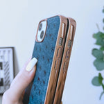 Custodia in vera pelle con texture di struzzo per iPhone 14