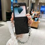 Custodia con cinturino da polso e ganci metallici per Samsung Galaxy Z Flip6/7