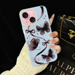 Custodia ibrida PC TPU con motivo farfalle per iPhone 15