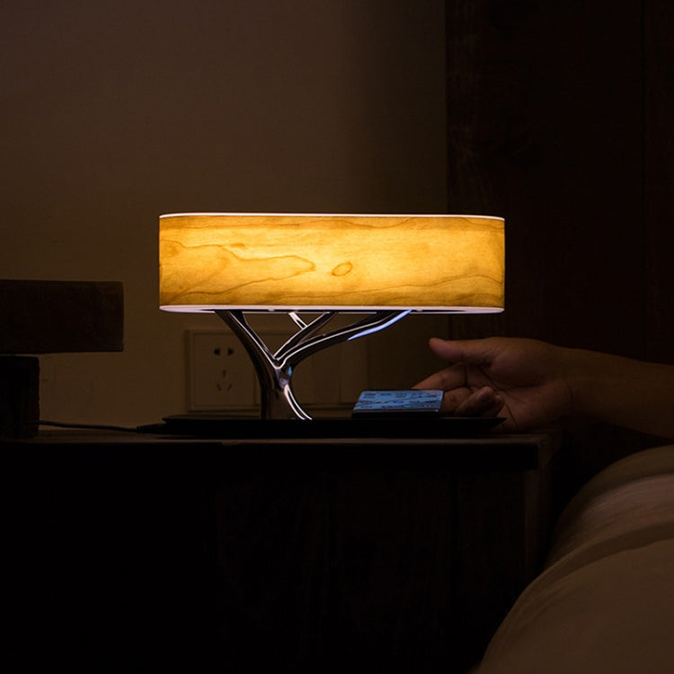 Caricabatterie wireless con lampada Bluetooth e altoparlante