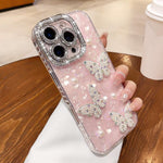 Custodia con texture conchiglia, perle e glitter per iPhone 16 Pr