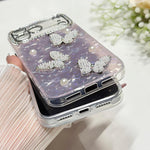 Custodia con texture conchiglia, perle e glitter per iPhone 16 Pr