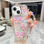 Custodia TPU con farfalla 3D glitterata e catena per iPhone 15 Pr
