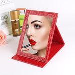 Specchio cosmetico portatile in pelle con supporto