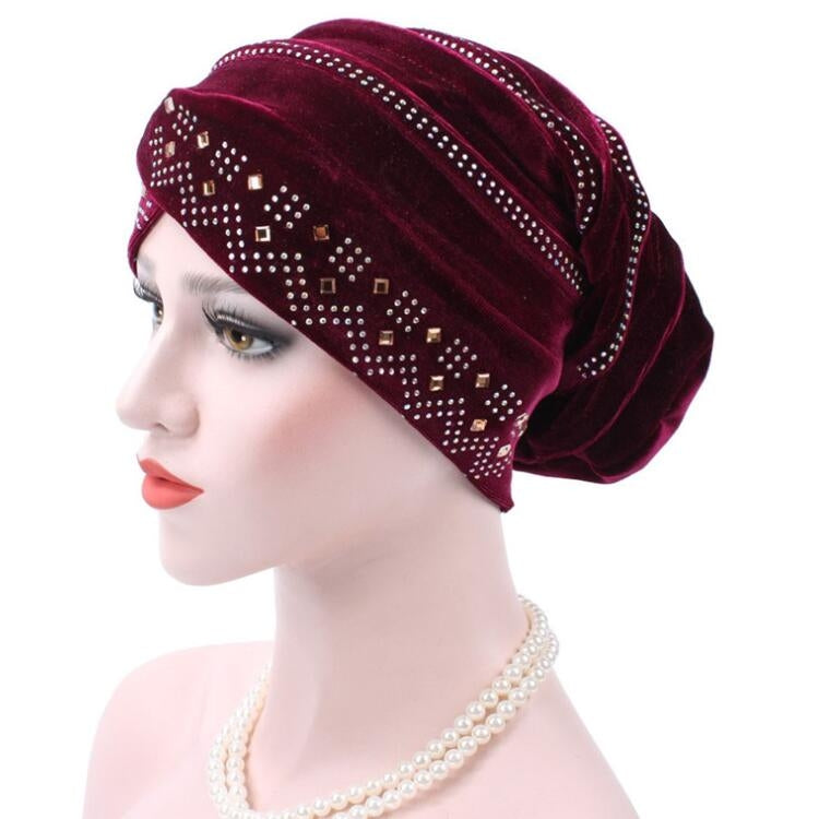 Cappello impilabile con turbante e strass in pleuche