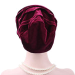 Cappello impilabile con turbante e strass in pleuche