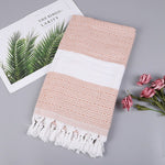 Asciugamano da bagno in cotone a righe con nappe
