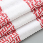 Asciugamano da bagno in cotone a righe con nappe