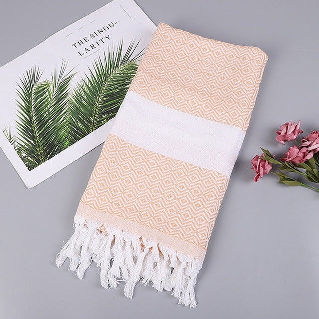 Asciugamano da bagno in cotone a righe con nappe