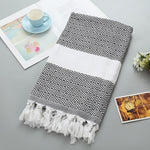Asciugamano da bagno in cotone a righe con nappe
