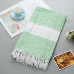 Asciugamano da bagno in cotone a righe con nappe