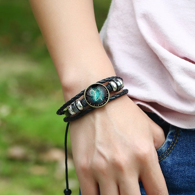 Bracciale rigido con perline e costellazioni in pelle