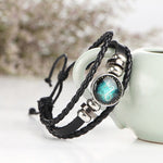 Bracciale rigido con perline e costellazioni in pelle