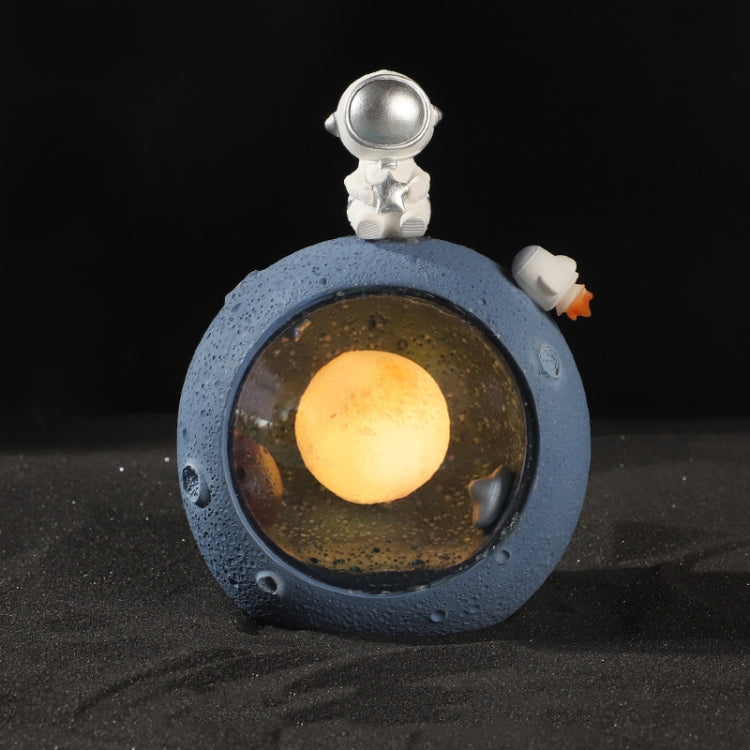 Lampada Notturna Resina Pianeta con Astronauta e Stelle