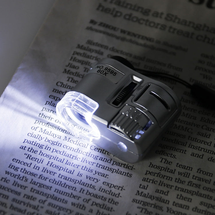 Mini microscopio portatile 60X con luce UV e LED - immagine 6