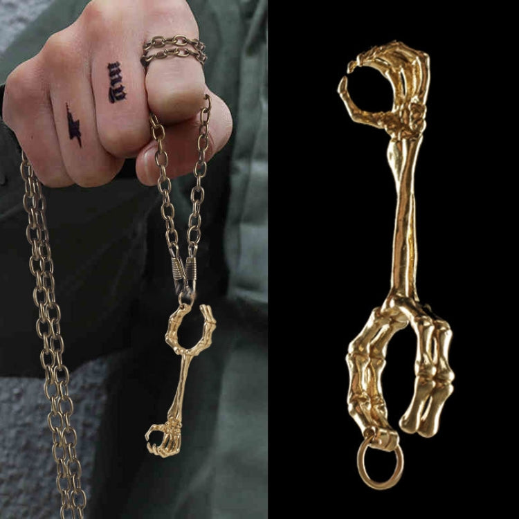 Anello con teschio in rame placcato oro e argento