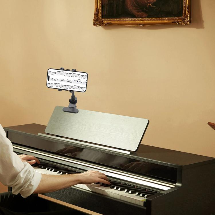 Supporto universale per telefono per registrare video di lezioni di chitarra/basso/ukulele in diretta streaming.