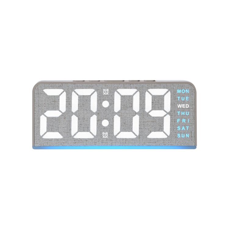Sveglia digitale con retroilluminazione ambientale, visualizzazione di ora, giorno della settimana, data e temperatura.