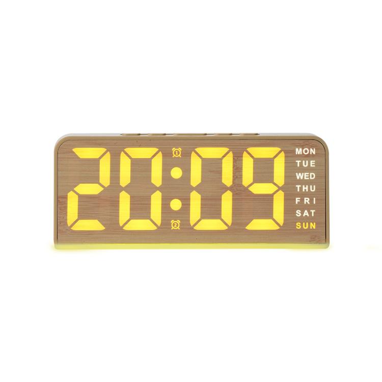 Sveglia digitale con retroilluminazione ambientale, visualizzazione di ora, giorno della settimana, data e temperatura.