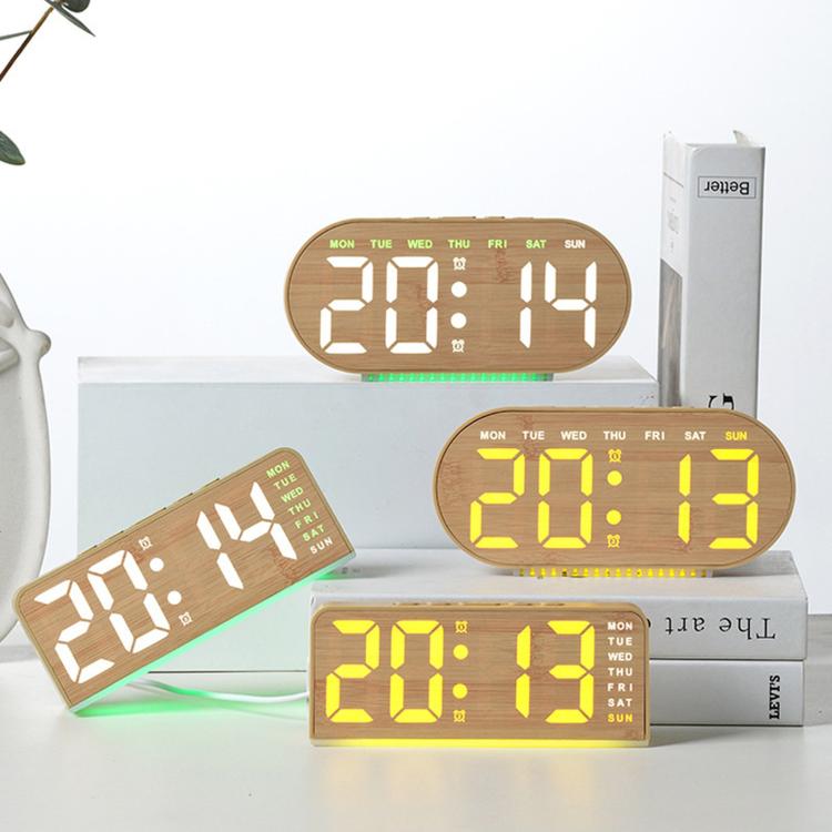Sveglia digitale con retroilluminazione ambientale, visualizzazione di ora, giorno della settimana, data e temperatura.