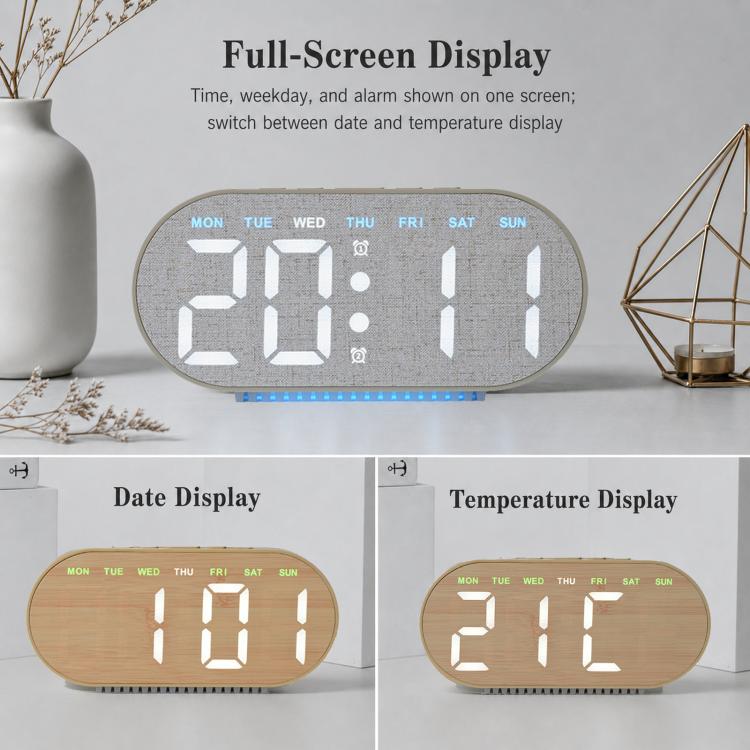Sveglia digitale con retroilluminazione ambientale, visualizzazione di ora, giorno della settimana, data e temperatura.