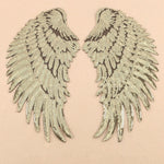Patch adesive ali di piume con paillettes oro e argento