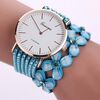 Orologio da donna con quadrante rotondo e fiore con borchie e diamanti (azzurro)
