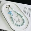 Catena per cellulare con fiocco in vetro e perle (blu)