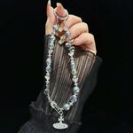 Catena per telefono Saturno in lega di perle di cristallo (bianco pallido)