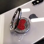 Supporto rotondo in metallo con anello per cellulare con cuore glitterato (argento)