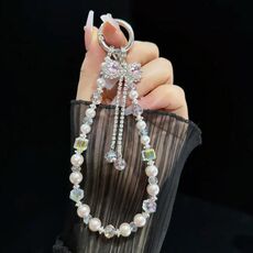 Bracciale con fiocco e nappa (rosa)
