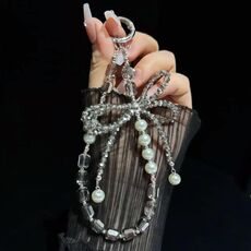 Catena per telefono con fiocco di cristallo e perle di cristallo (grigio)