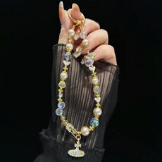 Catena per telefono Saturno in lega di perle di cristallo (dorata)