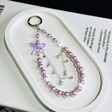 Catena per cellulare con fiocco in vetro e perle (viola)