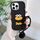 Custodia per telefono in TPU con bocca di salsiccia dei cartoni animati per iPhone 16 Pro con catena di perline (nera) Custodia per telefono in TPU con bocca di salsiccia dei cartoni animati per iPhone 16 Pro con catena di perline (nera)