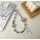 Catena per telefono con farfalla in strass in lega (nera)